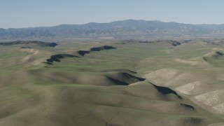 4K aerial stock footage Flyby rolling green hills, San Benito County, California Aerial Stock Footage | AX70_166