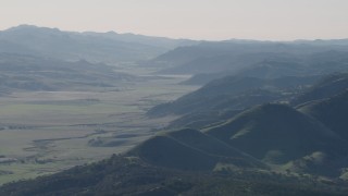 4K aerial stock footage Valley bordered by green hills in San Benito County, California Aerial Stock Footage | AX70_172