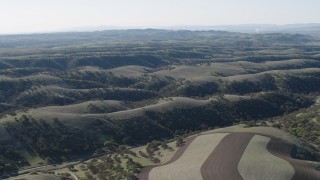 4K aerial stock footage Flying over green hills in San Benito County, California Aerial Stock Footage | AX70_174