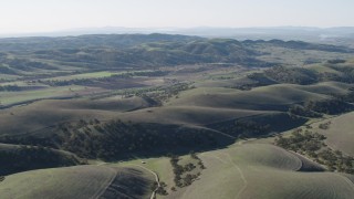 4K aerial stock footage Approach small farms from the hills in San Benito County, California Aerial Stock Footage | AX70_180