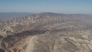 4K aerial stock footage Passing a rugged desert mountains in the Caliente Mountain Range, California Aerial Stock Footage | AX70_204