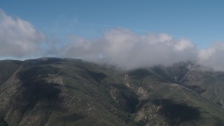 4K aerial stock footage Santa Lucia Range mountains capped by clouds in California Aerial Stock Footage | AX70_259