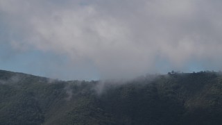 4K aerial stock footage of clouds over a Santa Lucia Range mountain ridge in California Aerial Stock Footage | AX70_266