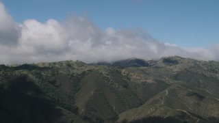 AX70_270 - 4K aerial stock footage of clouds over mountains in the Santa Lucia Range in California