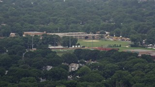 5.1K aerial stock footage flying by Seaford High School and football fields, Seaford, Long Island, New York Aerial Stock Footage | AX71_004