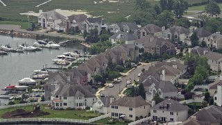 5.1K aerial stock footage flying by waterfront homes beside a canal, Seaford, Long Island, New York Aerial Stock Footage | AX71_006