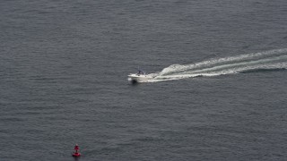 AX71_019 - 5.1K aerial stock footage of a fishing boat sailing across Jones Bay in Wantagh, Long Island, New York