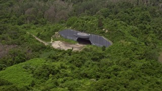 AX71_040 - 5.1K aerial stock footage flying past a casemate in Fort Tilden, Queens, New York