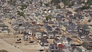 5.1K aerial stock footage flying past beachfront homes in Breezy Point, Queens, New York Aerial Stock Footage | AX71_041E