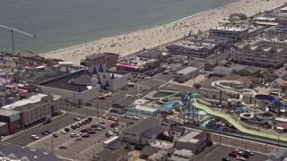 AX71_098E - 5.1K aerial stock footage orbiting Breakwater Beach Waterpark and Casino Pier, Seaside Heights, Jersey Shore, New Jersey