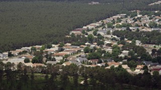 5.1K aerial stock footage flying by rooftops of suburban homes, Toms River, New Jersey Aerial Stock Footage | AX71_112