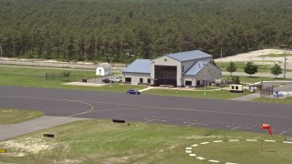 AX71_115 - 5.1K aerial stock footage approaching Robert J Miller Airport for a landing in Forked River, New Jersey