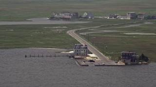 AX71_143 - 5.1K aerial stock footage of bayfront homes in West Creek, New Jersey