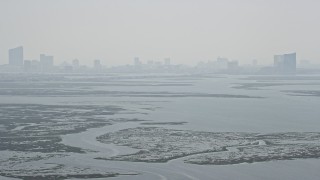 5.1K aerial stock footage tilting from Little Bay to reveal marshland and Atlantic City skyline in New Jersey Aerial Stock Footage | AX71_158