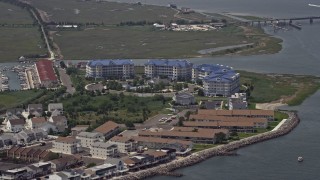 5.1K aerial stock footage of waterfront apartment complex near Grassy Sound Bridge in North Wildwood, New Jersey Aerial Stock Footage | AX71_258