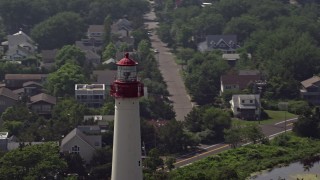 5.1K aerial stock footage of the top of Cape May Lighthouse and coastal neighborhood, New Jersey Aerial Stock Footage | AX72_009