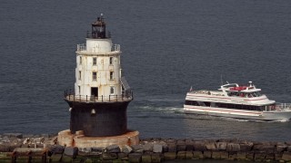 5.1K aerial stock footage orbiting the Harbor of Refuge Light, Delaware, and reveal a ferry Aerial Stock Footage | AX72_022E