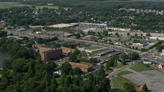 AX72_070 - 5.1K aerial stock footage of apartment building and hotels, with strip malls and stores across Dupont Highway in Dover, Delaware