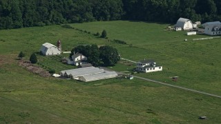 5.1K aerial stock footage of a farmhouse, barns, and greenhouses in Dover, Delaware Aerial Stock Footage | AX72_086