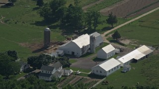 5.1K aerial stock footage approaching a farmhouse, barn, and silos in Dover, Delaware Aerial Stock Footage | AX72_088