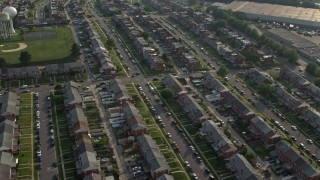 AX73_059 - 5.1K aerial stock footage flying over a neighborhood of row houses in Baltimore, Maryland