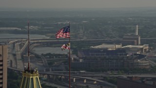 5.1K aerial stock footage orbiting American and Maryland flags, Downtown Baltimore, Maryland Aerial Stock Footage | AX73_089