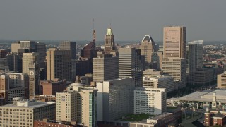 AX73_115E - 5.1K aerial stock footage of Oriole Park baseball stadium and Downtown Baltimore skyscrapers, Maryland