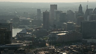 AX73_123 - 5.1K aerial stock footage of a reverse view of Downtown Baltimore skyscrapers, Maryland