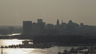 AX73_146 - 5.1K aerial stock footage of Downtown Baltimore skyline and the Henderson's Wharf Marina, Maryland