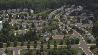 4.8K aerial stock footage flying by a suburban neighborhood in Manassas, Virginia Aerial Stock Footage | AX74_007E