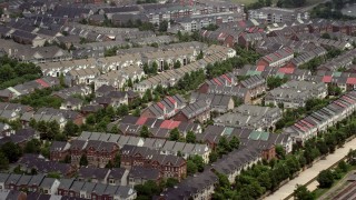 AX74_023E - 4.8K aerial stock footage flying by row houses in Alexandria, Virginia