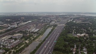 4.8K aerial stock footage of light traffic on Interstate 95 by homes in Alexandria, Virginia Aerial Stock Footage | AX74_025