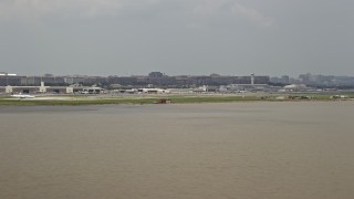 AX74_033 - 4.8K aerial stock footage of Ronald Reagan Washington National Airport in Arlington, Virginia