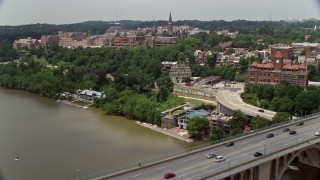 4.8K aerial stock footage flying over Francis Scott Key Bridge to approach Georgetown University in Washington DC Aerial Stock Footage | AX74_080E