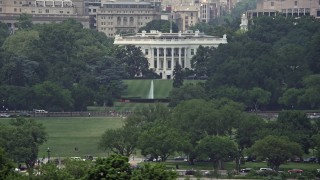 AX74_088 - 4.8K aerial stock footage of The White House and South Lawn Fountain in Washington DC, revealing Washington Monument