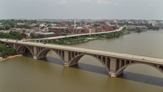 AX74_105 - 4.8K aerial stock footage tracking light traffic on the Francis Scott Key Bridge in Washington DC