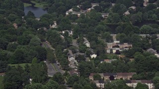 4.8K aerial stock footage approaching and tilting to row houses and residential streets in Burke, Virginia Aerial Stock Footage | AX75_018