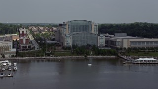 AX75_041 - 4.8K aerial stock footage of the Waterfront Gaylord National Resort & Convention Center in National Harbor, Maryland