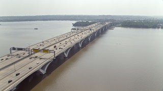 4.8K aerial stock footage tracking light traffic on Woodrow Wilson Memorial Bridge in Maryland Aerial Stock Footage | AX75_042