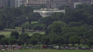 4.8K aerial stock footage of the White House partially hidden by trees in Washington DC Aerial Stock Footage | AX75_076