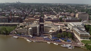 AX75_092 - 4.8K aerial stock footage approaching and tilting to the Washington Harbour in Georgetown, Washington DC