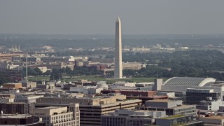 4.8K aerial stock footage of the Washington Monument seen from office building rooftops in Washington DC Aerial Stock Footage | AX75_095