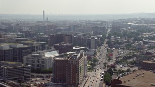 4.8K aerial stock footage office buildings on New York Ave with Washington Monument in distance in Washington DC Aerial Stock Footage | AX75_108