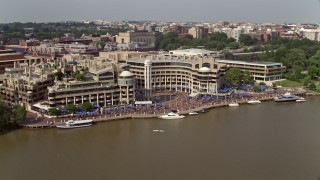 AX75_123 - 4.8K aerial stock footage of Washington Harbour condo complex by the Potomac River in Georgetown, Washington DC