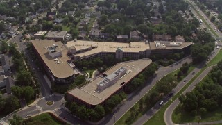 AX75_139 - 4.8K aerial stock footage approaching and tilting to office buildings in Arlington, Virginia