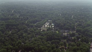 4.8K aerial stock footage flying over tree-lined neighborhoods in Falls Church, Virginia Aerial Stock Footage | AX75_148E