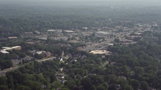 AX75_150 - 4.8K aerial stock footage of shops along Columbia Pike in Annandale, Virginia