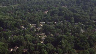 4.8K aerial stock footage of suburban neighborhoods with trees in Annandale, Virginia Aerial Stock Footage | AX75_154E