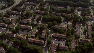 AX75_162 - 4.8K aerial stock footage tilting to a bird's eye view of row houses in Fairfax, Virginia 