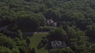 4.8K aerial stock footage tilting to a bird's eye view of a spacious mansion in Fairfax Station, Virginia Aerial Stock Footage | AX75_166